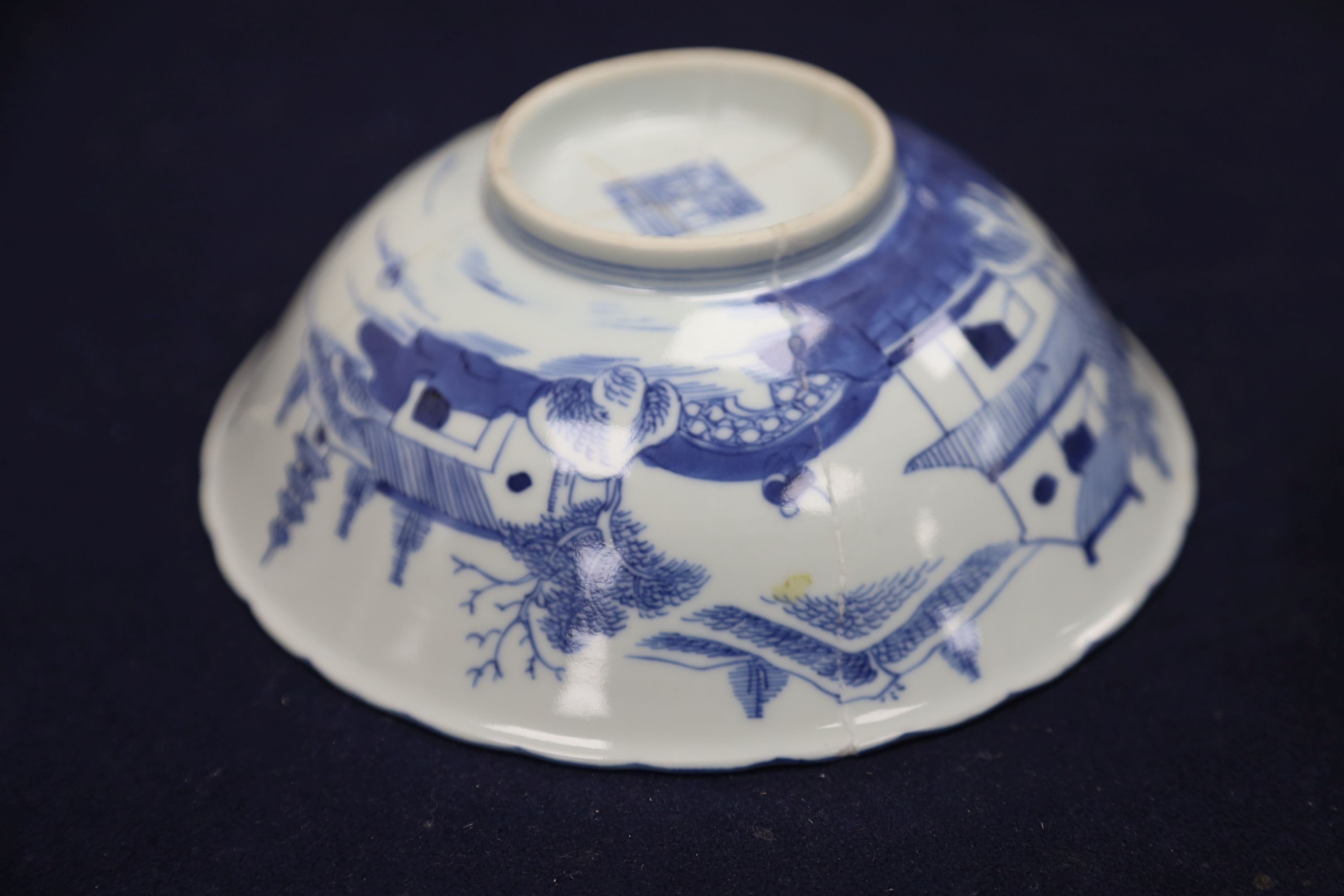 A Chinese blue and white landscape bowl, a/f and a Chinese blue and white 'dragon' dish, 18cm and 16.5cm